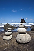 Stacks of pebbles on seaside beach