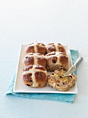 Hot cross buns with a knife