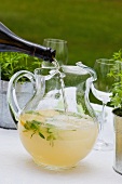 Woodruff punch being topped up with Prosecco