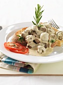 Toast topped with mushrooms and rosemary