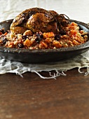 Orange chicken with oven-roasted vegetables and couscous