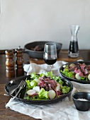 Salad with pepper steak and potatoes