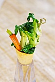Bok choy and carrots in a wafer cone
