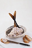Mackerel pate in a shell garnished with a mackerel tail