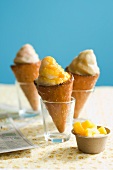 Three Ice Cream Cones in Glasses; Bowl of Mango