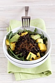 Rocket salad with lentils, mango and avocado