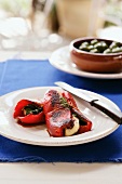 Grilled peppers with haloumi wrapped in basil