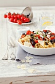 Spaghetti with cherry tomatoes, black olives, basil and Parmesan