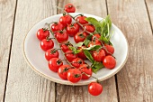 Cherry tomatoes and basil on a plate