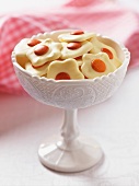 Flower-shaped biscuits in a ceramic bowl