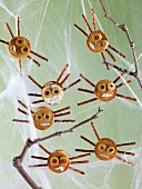 Insects: crackers with pretzel sticks and olives