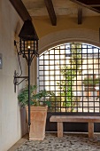 Wrought iron lantern on veranda wall of a Mediterranean house