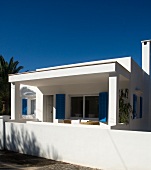 White Mediterranean house below a blue sky