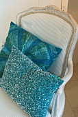 Cushions with blue covers on antique, Rococo wooden chair