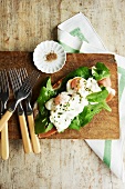 Breakfast Bruschetta Made with Poached Eggs, Prosciutto and Arugula; Forks