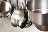 Saucepans and pots on a wall