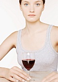 A woman with a glass of red wine