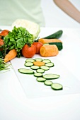 Fresh vegetable slices arranged in shape of flower, close-up