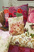 Floral-patterned cushions on upholstered couch