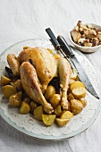 Stuffed Roast chicken with liquorice on a bed of potatoes