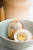 Tea-boiled eggs with sesame seeds