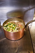 Vegetable stock in a saucepan