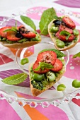 Toast topped with broad beans and strawberries
