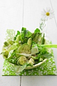 Mixed leaf salad with artichokes and Parmesan