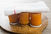 Jars of apricot jam turned upside down