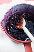 Blackberry jam in a saucepan