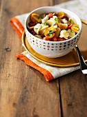 Orecchiette pasta with cherry tomatoes and goat's cheese