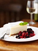 A slice of cheesecake with berry compote