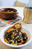 Black cabbage, bean and crostini stew (Tuscany, Italy)
