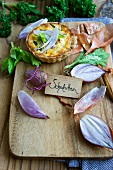 A mini quiche with shallots and celery