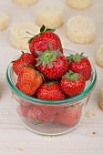 Fresh strawberries and round slices of cake (ingredients for push-up cake pops)