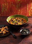 Pumpkin soup with curry, leek, pumpkin seeds and croutons