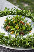Salad with chickweed (stellaria media), sweetcorn and nuts