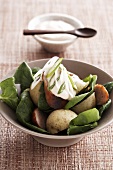 Warm potato salad with sausage and spinach
