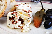 Marinated cheese (Agri die Valtorta) with chilli and olive oil (Italy)