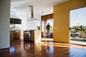 Empty Modern Condominium with Man at Window