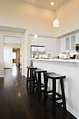 Three bar stool in a contemporary kitchen