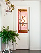 White door with elaborate leaded window