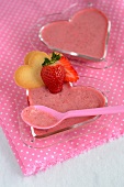 Strawberry cream in heart-shaped glass bowls