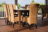 Outdoor dining table and wicker chairs