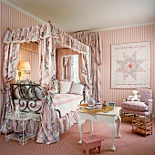 Pink girl's bedroom with canopied bed