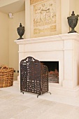 Fireplace screen in front of stone fireplace