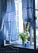 Curtain made of blue and white dish towels