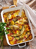 Gratinated chicory with potatoes and ham