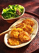 Parsnip and pumpkin cakes with a side salad
