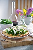 Crispy pizza topped with rocket